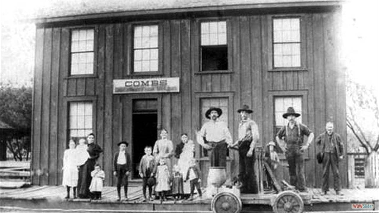 Combs Depot, David Lincoln Wilson is man on left by railroad car, with dark hat & moutache